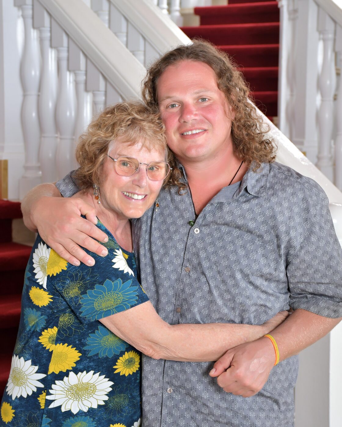 Woman and man laughing together on the staircase