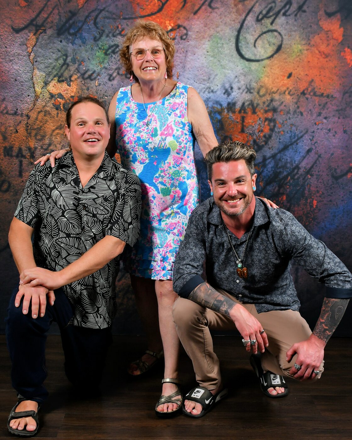 Group of four on a painted backdrop